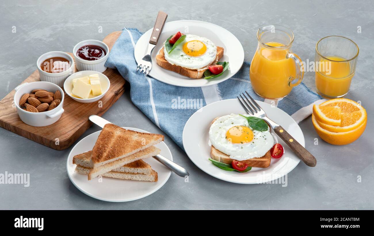 Traditional American breakfast on grey background . Stock Photo