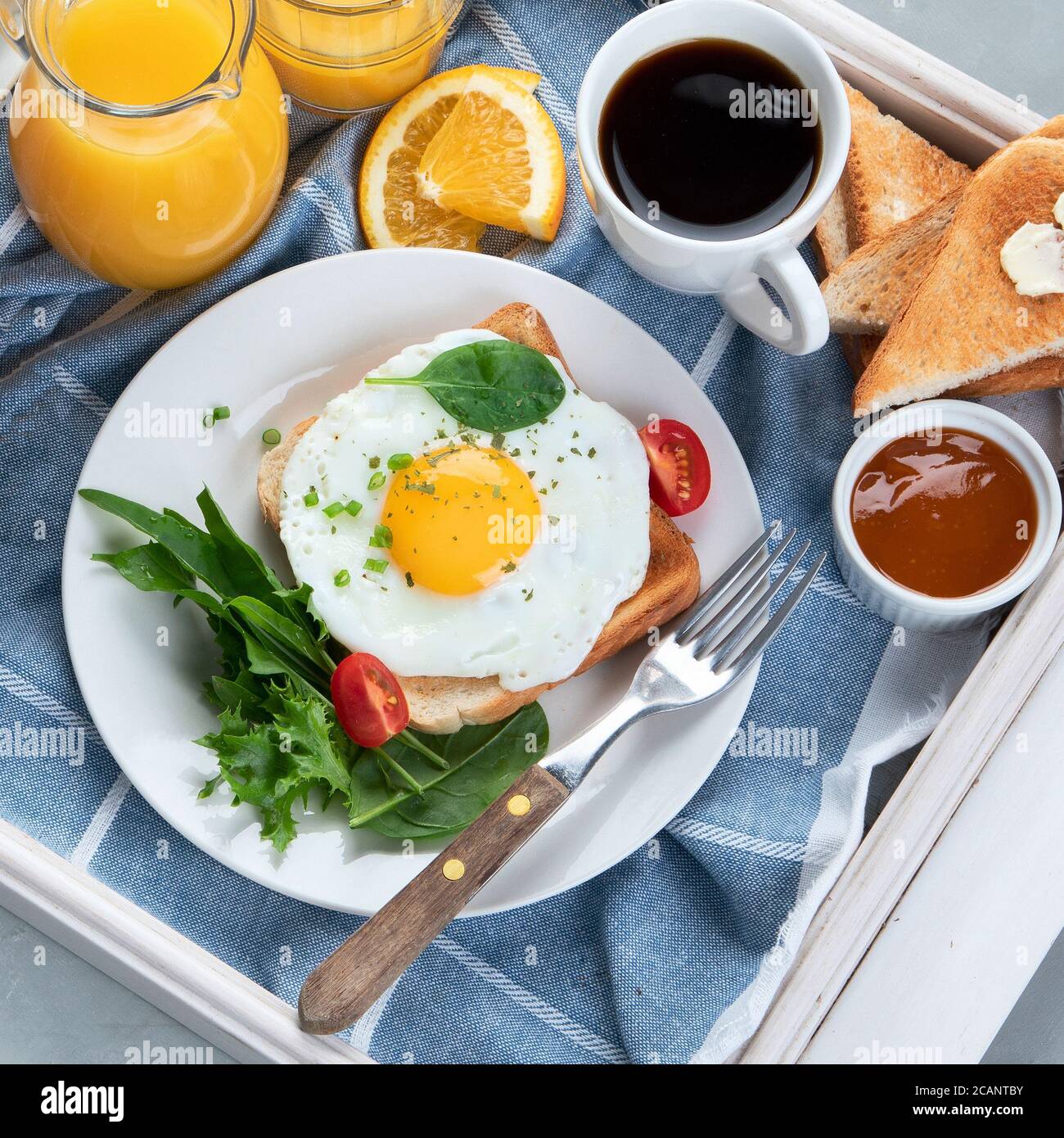 Traditional American breakfast served in white wooden tray on grey background . Top view, flat lay. Stock Photo