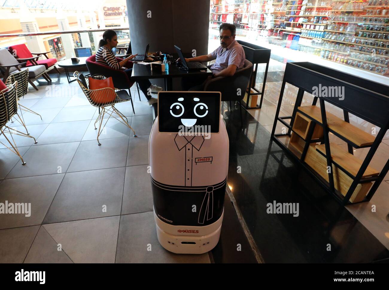 Cairo, Egypt. 7th Aug, 2020. A robot named Mozo, which means waiter in Spanish, delivers meals to customers at Kimbo Restaurant & Cafe in Cairo, Egypt, on Aug. 7, 2020. For the first time in Egypt, a restaurant has hired a robot to assist in serving the customers to maintain social distancing amid the COVID-19 pandemic. TO GO WITH 'Feature: Egyptian restaurant hires robot waiter to maintain social distancing amid COVID-19 outbreak' Credit: Ahmed Gomaa/Xinhua/Alamy Live News Stock Photo