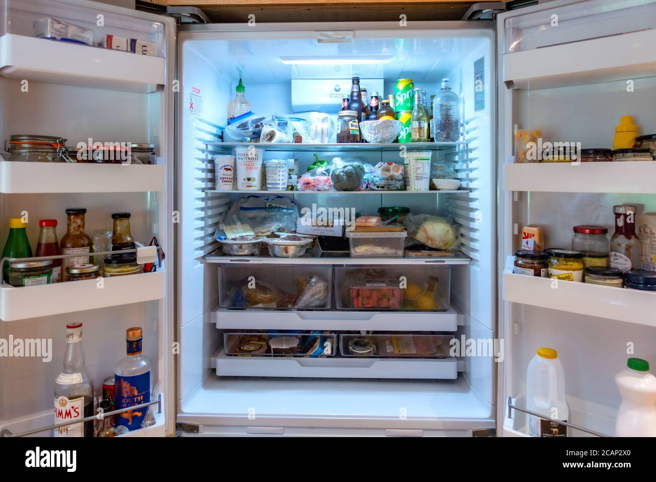 looking inside a large double fridge freezer Stock Photo