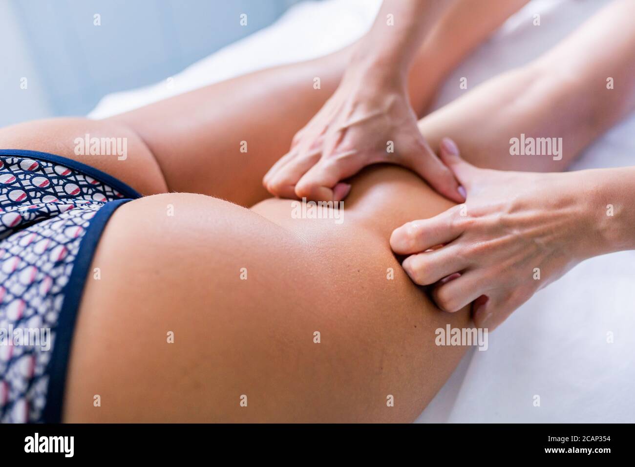 Legs and buttocks massage to reduce cellulite and phlebeurysm and preserve an healthy look image