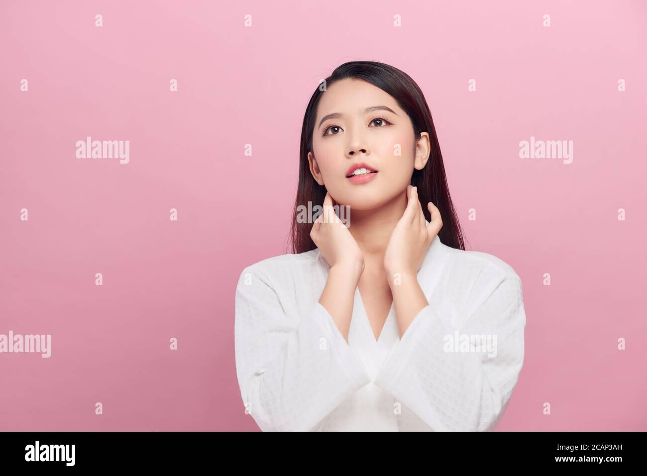 Beautiful Asian young woman touching neck smile with clean and fresh skin Stock Photo