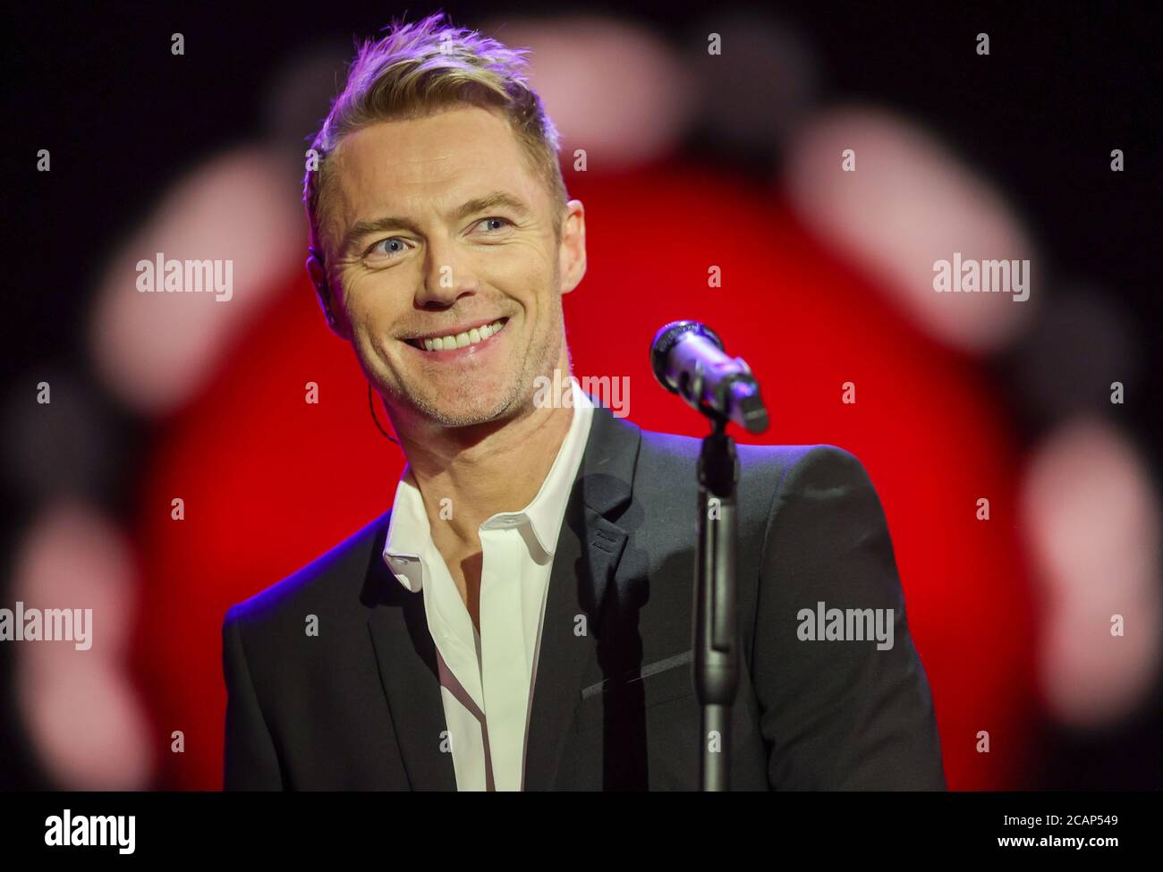06 August 2020, Saxony, Leipzig: The Irish singer Ronan Keating sings in the Roland Kaiser Show with the title 'Love can save us'. Because of Corona only a few people were allowed into the studio. Photo: Jan Woitas/dpa-Zentralbild/dpa Stock Photo