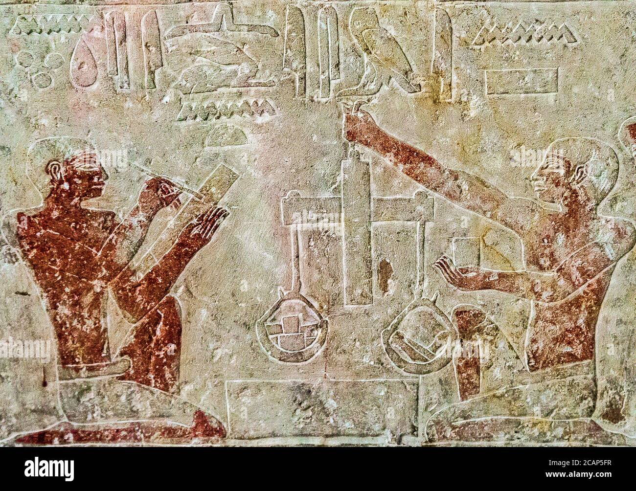 Egypt, Cairo, Egyptian Museum, from the tomb of Kaemrehu, Saqqara, detail of a big relief depicting craftsmen : Weighing gold. Stock Photo