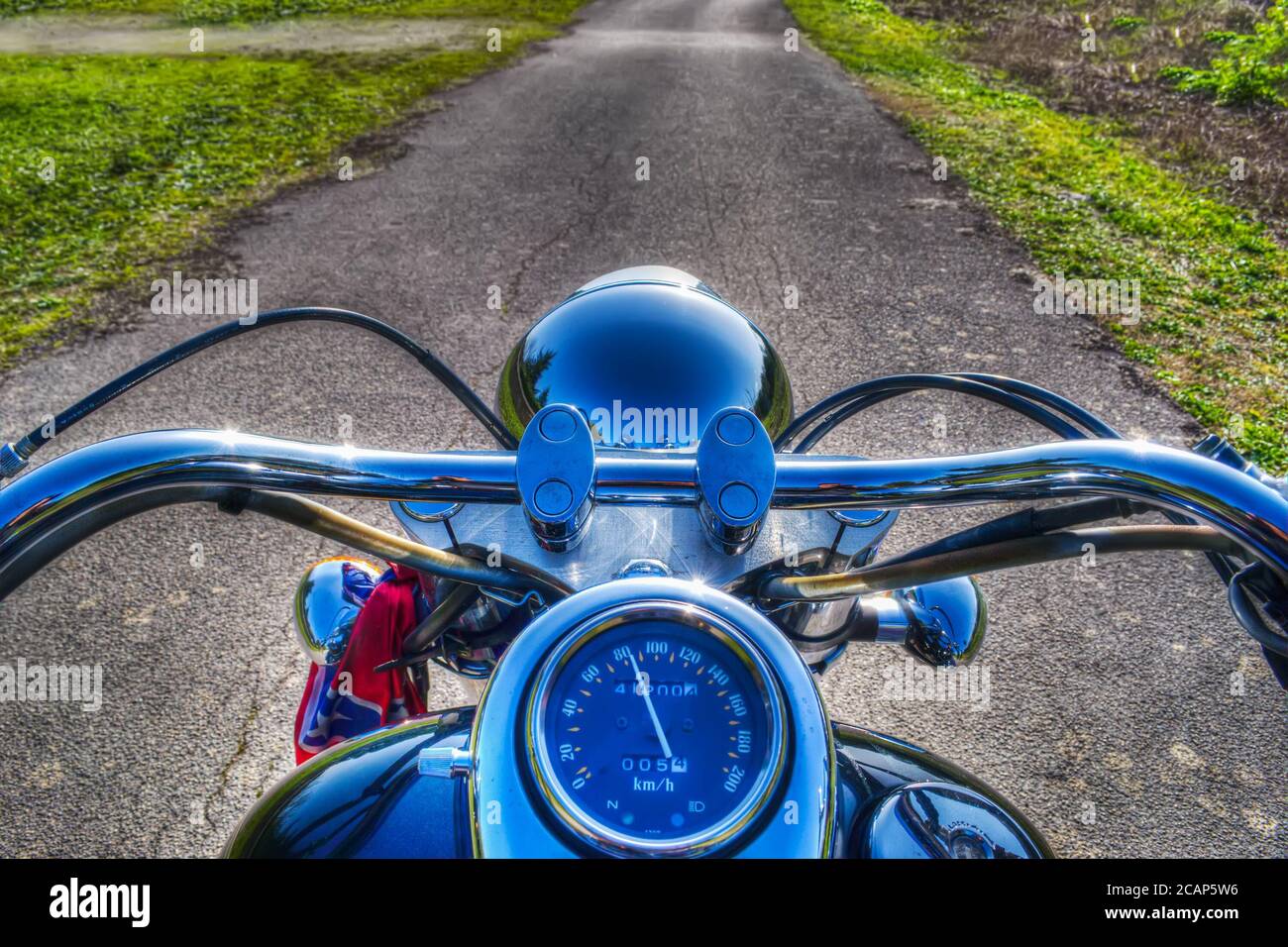 classic motorcycle on a country road in hdr tone mapping Stock Photo