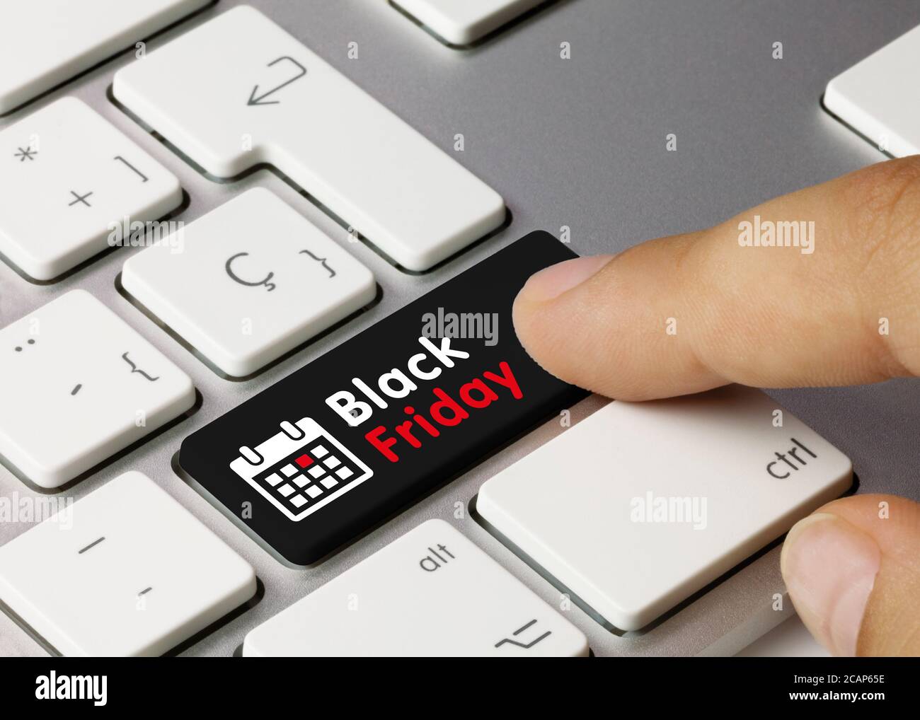 Black Friday Written on Black Key of Metallic Keyboard. Finger pressing key  Stock Photo - Alamy