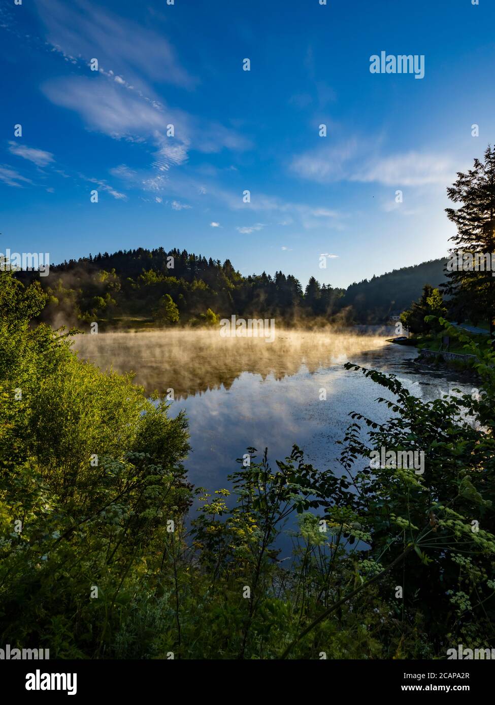 Morning bright mist fog above water surface of Lake Mrzla vodica in Croatia Europe countryside country-side Stock Photo