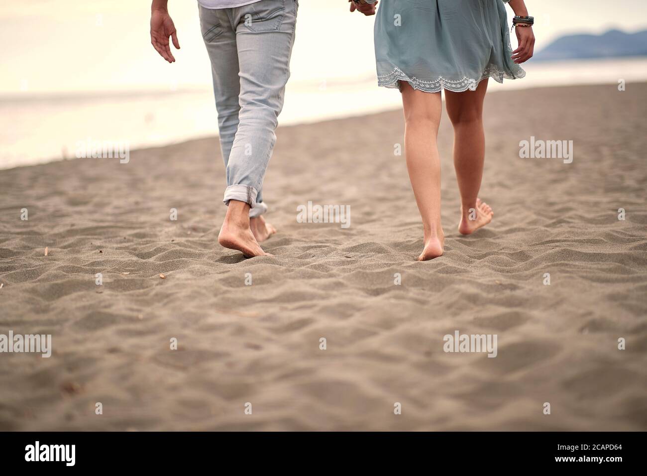 Young woman in jeans barefoot hi-res stock photography and images - Alamy