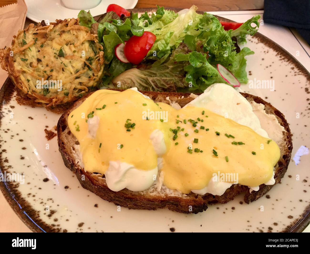 Poached Eggs with Ricotta Cheese, Hollandaise Sauce on Sourdough Bread