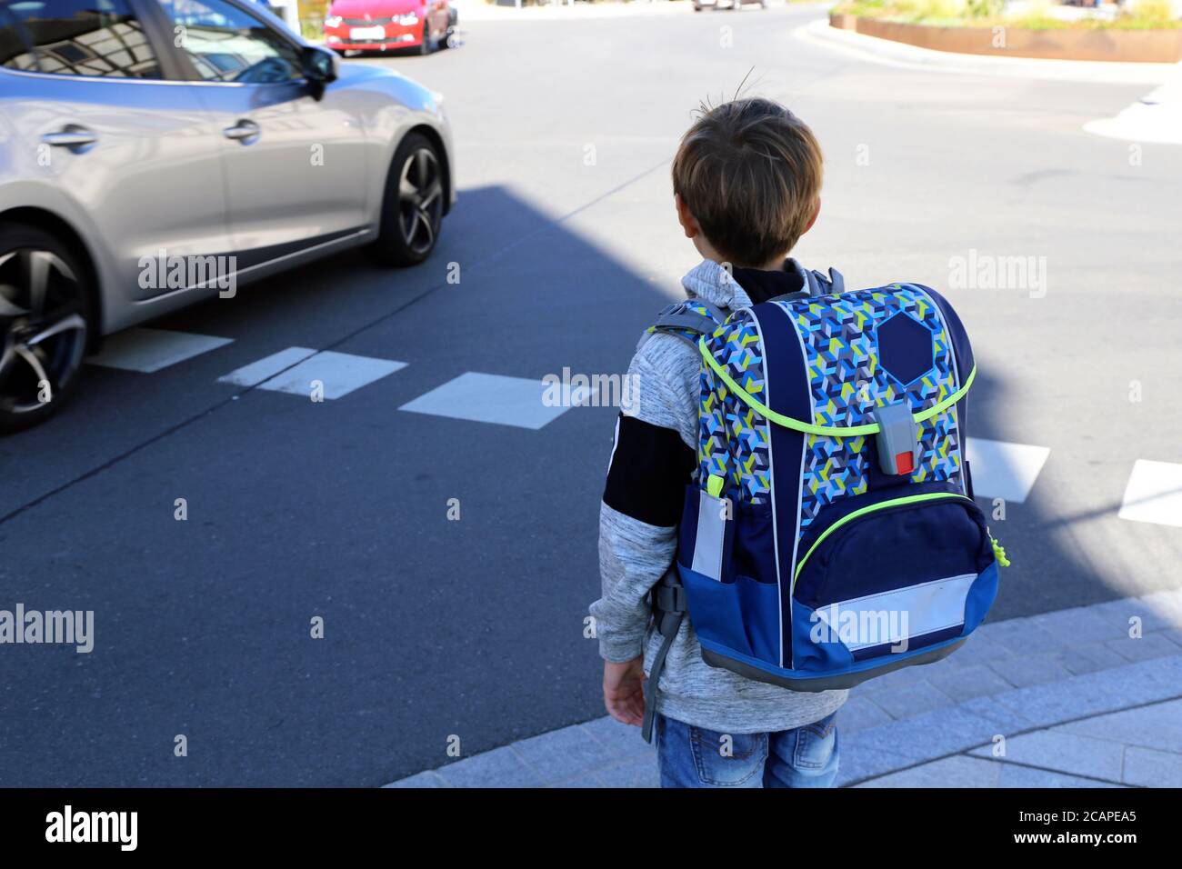 Symbol image: Schoolchild on the way to school (Model released) Stock Photo