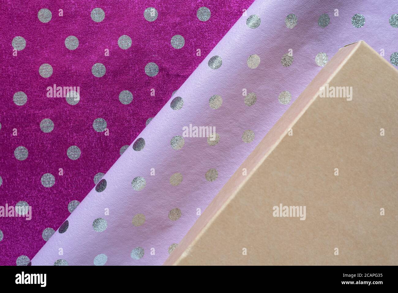 Violet shiny wrapping paper with polka dots with a fold. Foil for the  design of gift wrapping, wallpaper. Stylish shiny texture Stock Photo -  Alamy, image size:1300x957