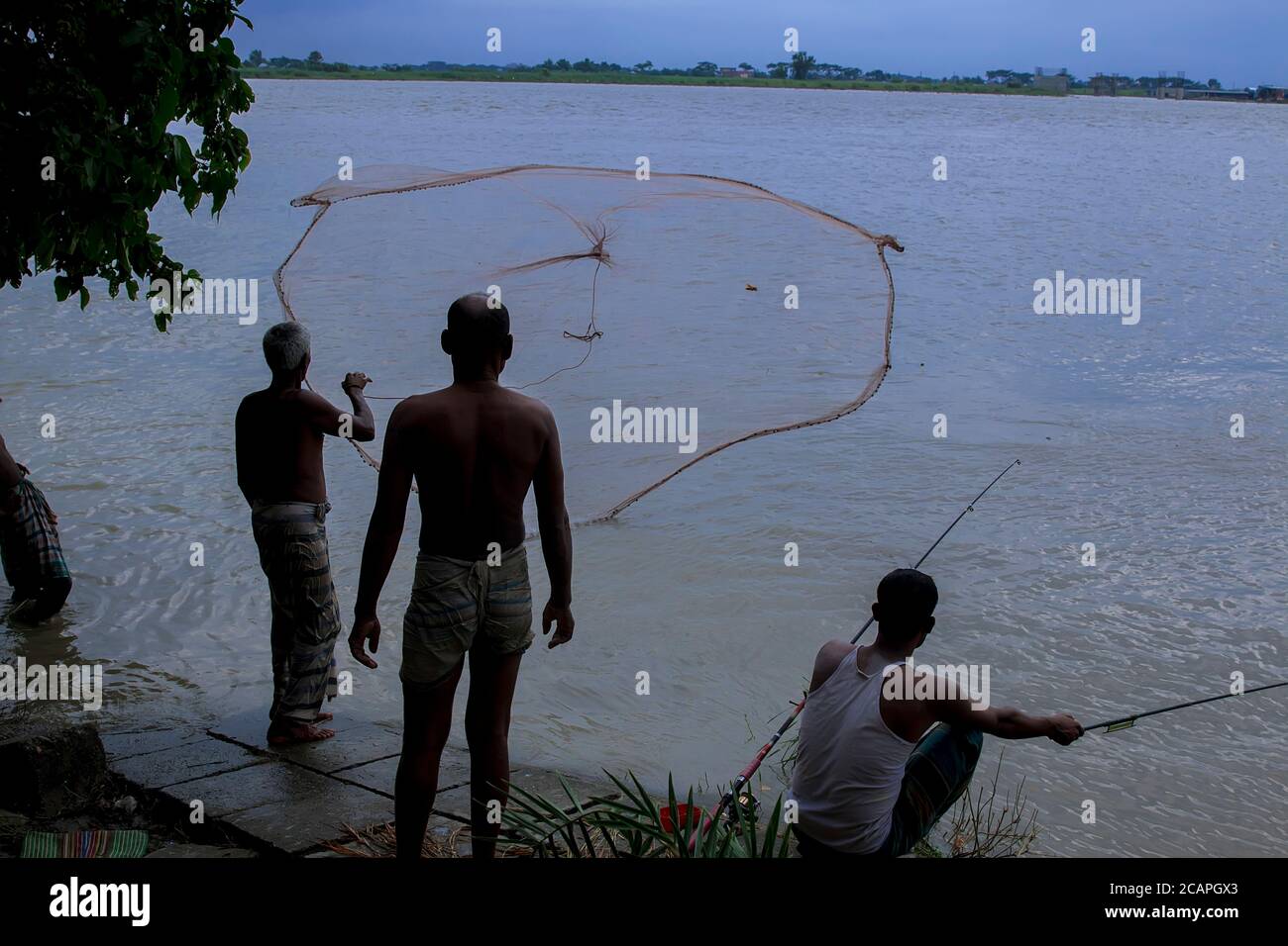 Padma of fishermen using coop-like trap catching fish in river,faridpur sadar,Bangladesh Stock Photo