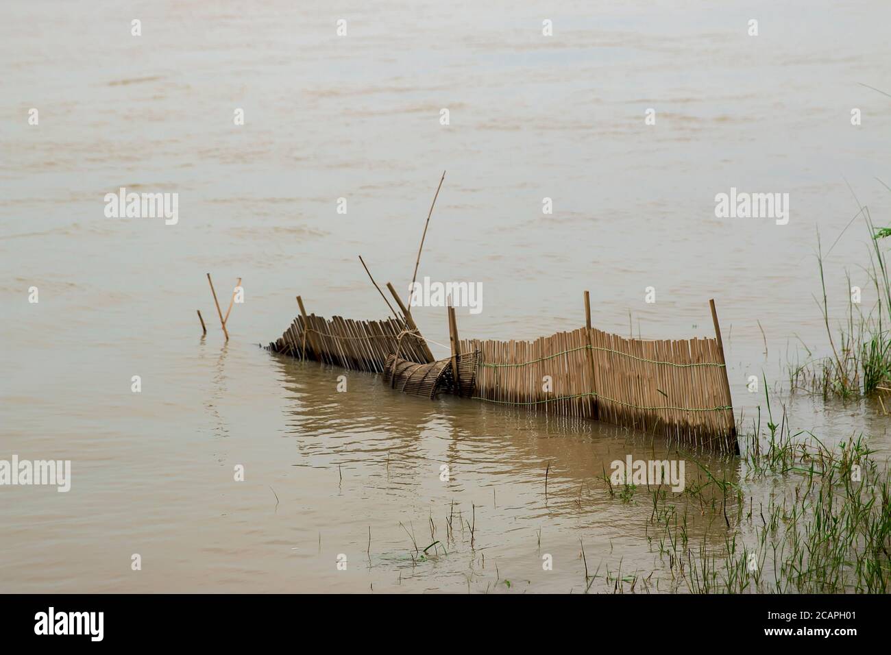 Bamboo fish-trap with a narrow neck - Bangladeshi traditional fishery tool Stock Photo