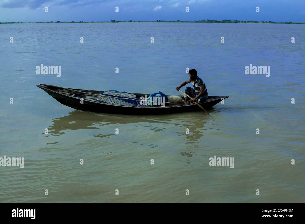 Small wooden boat float on the river Stock Photo Alamy