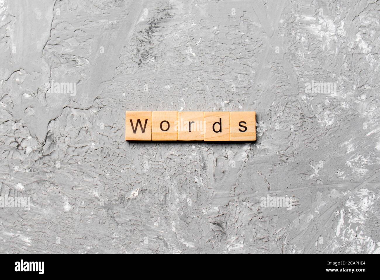 words written on wood block. WORDS text on cement table for your desing ...