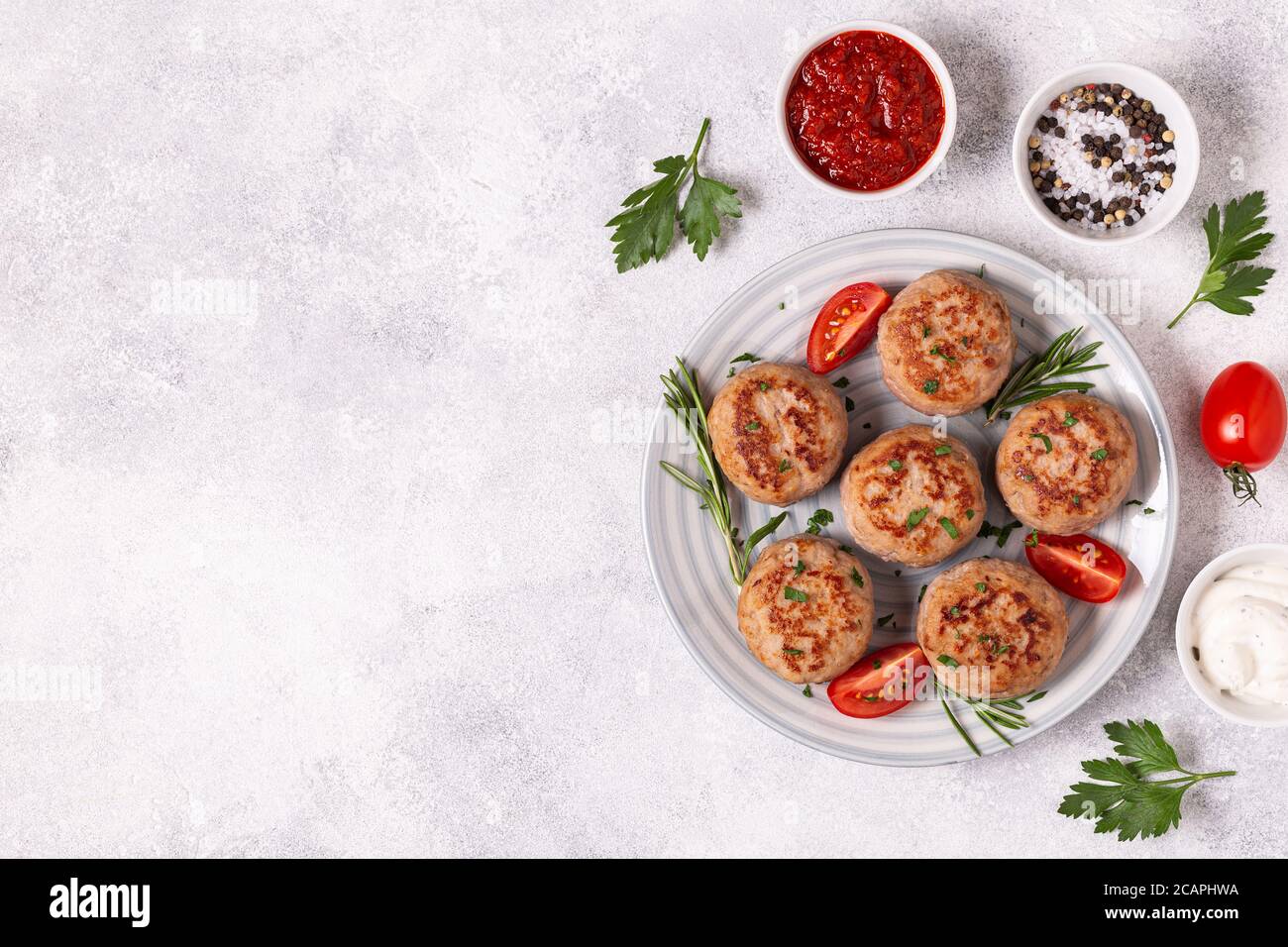 Fresh chiken cutlets with tomatoes and rosemary, top view Stock Photo ...