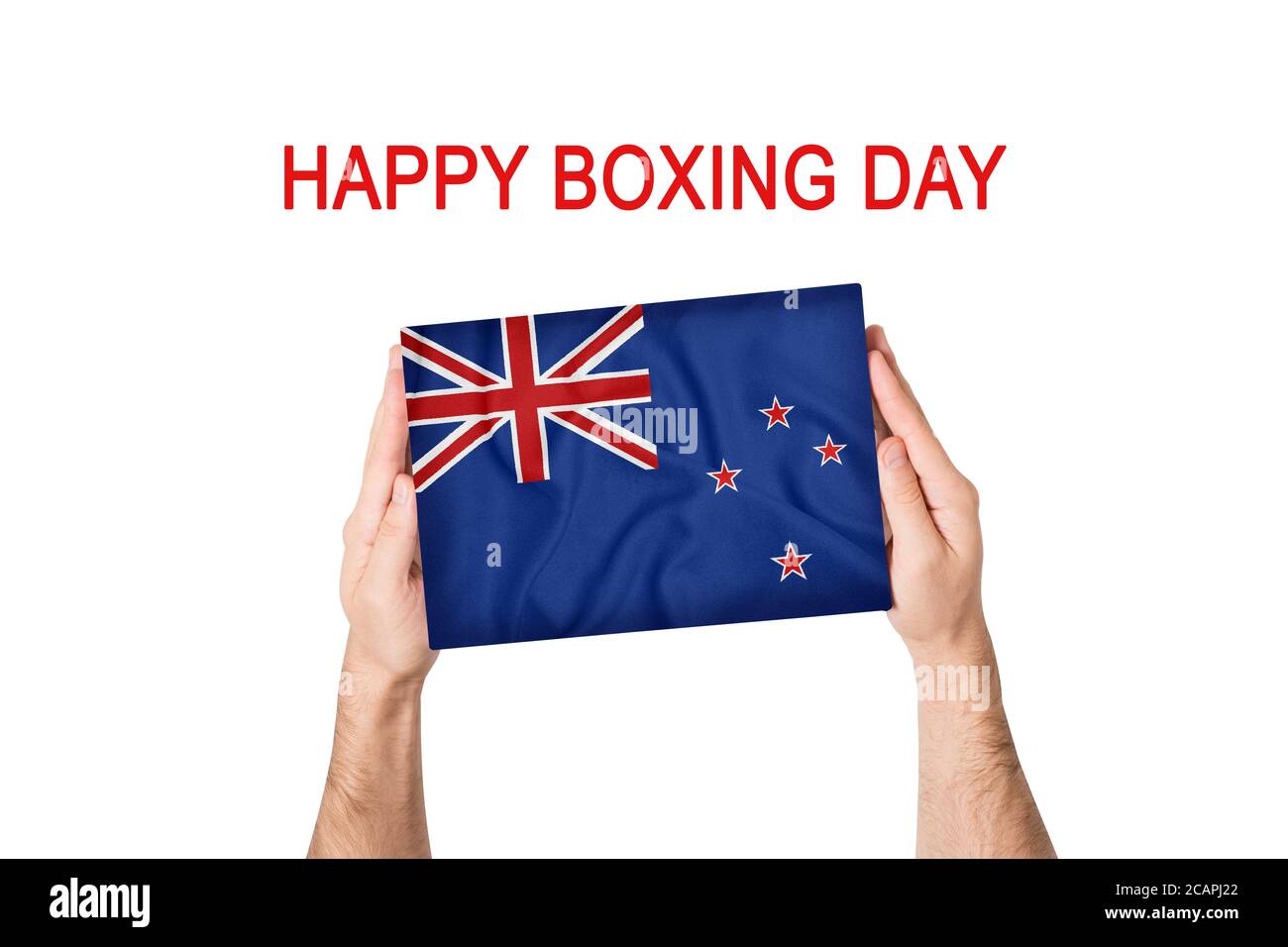 Happy boxing day. Box with New Zeland flag in male hands. White background Stock Photo