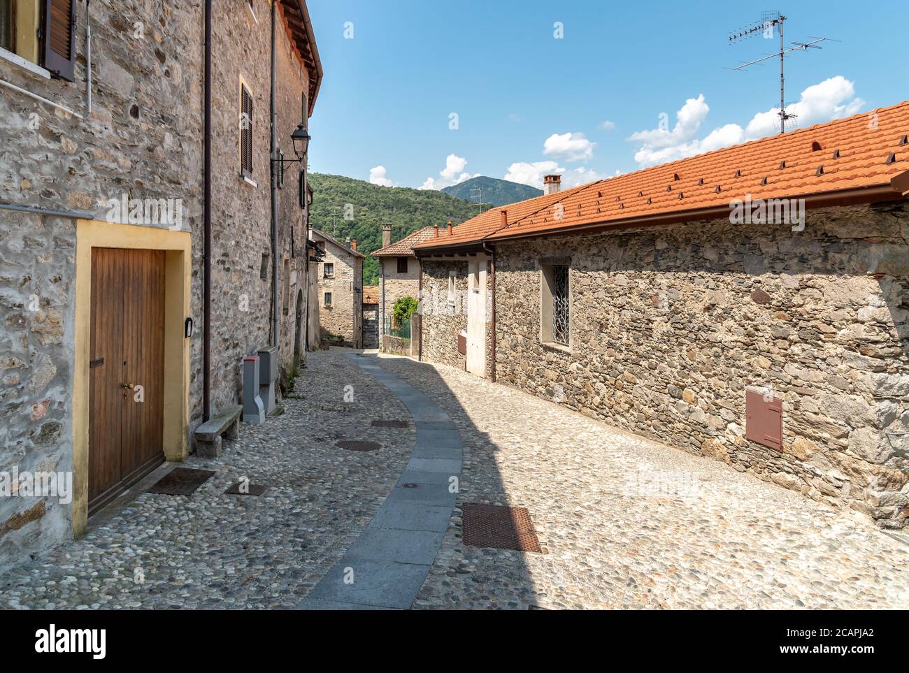Narrow streets wit stone houses in the small mountain village of Bassola, hamlet of Armeno above Lake Orta in the province of Novara, Piedmont, Italy Stock Photo