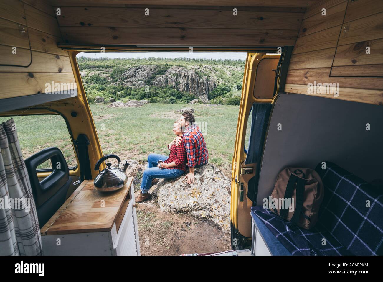Young Eastern European Couple Travelling By Yellow Camper Van Though The Countryside Self Built Off Grid Motorhome Camping In The Wild Nature Stock Photo Alamy