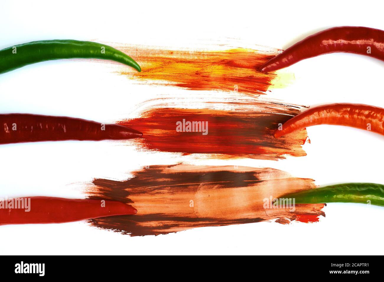 red and green pepper on a white background Stock Photo - Alamy