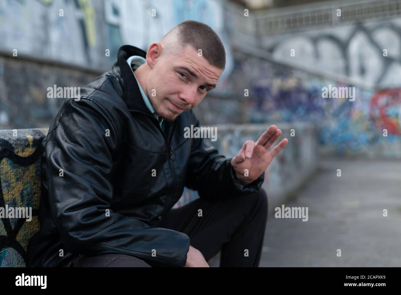 Bully criminal in black leather jacket Stock Photo