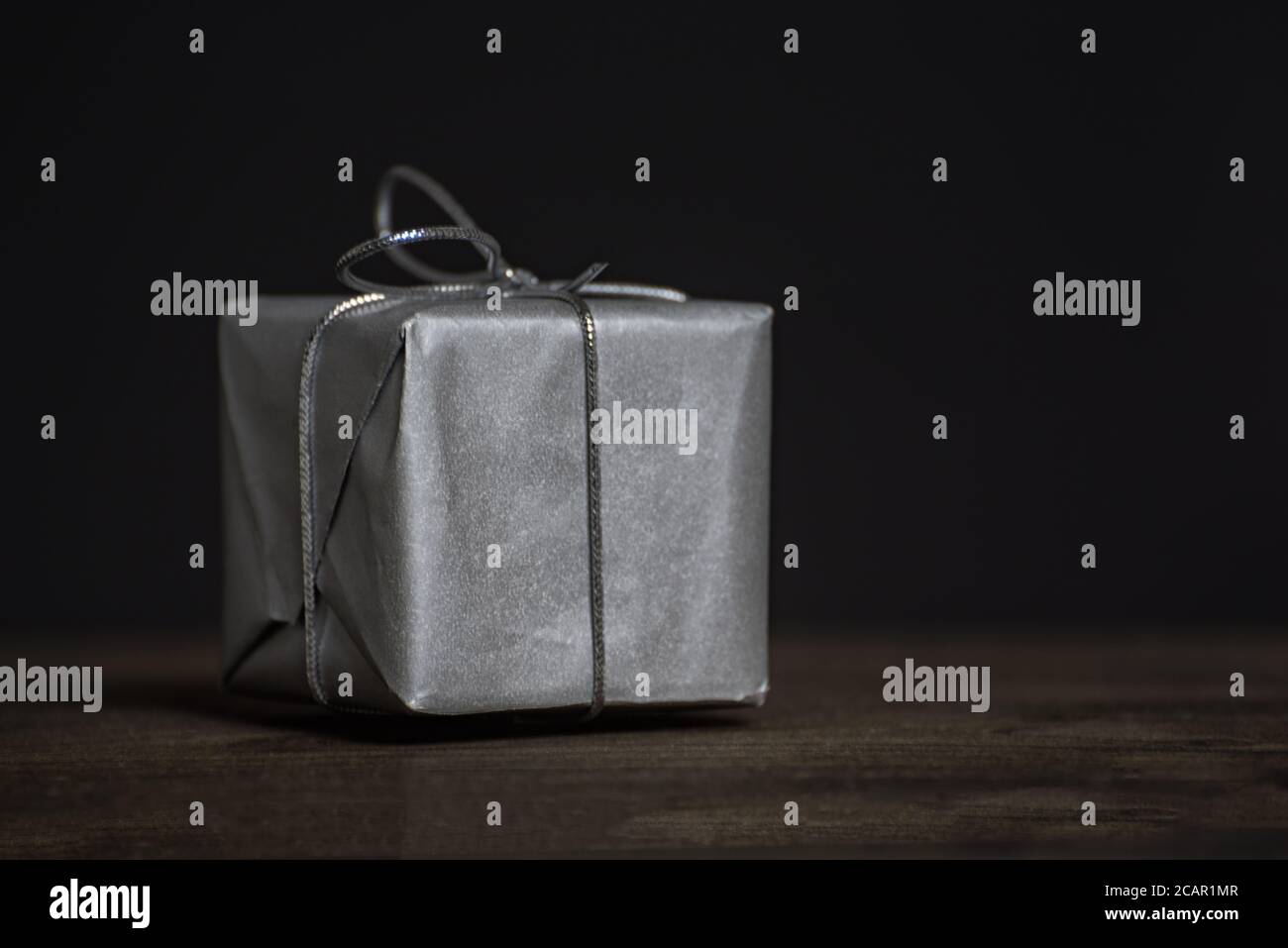 Present Front Gift closeup. Present for men on dark background, front view Stock ...