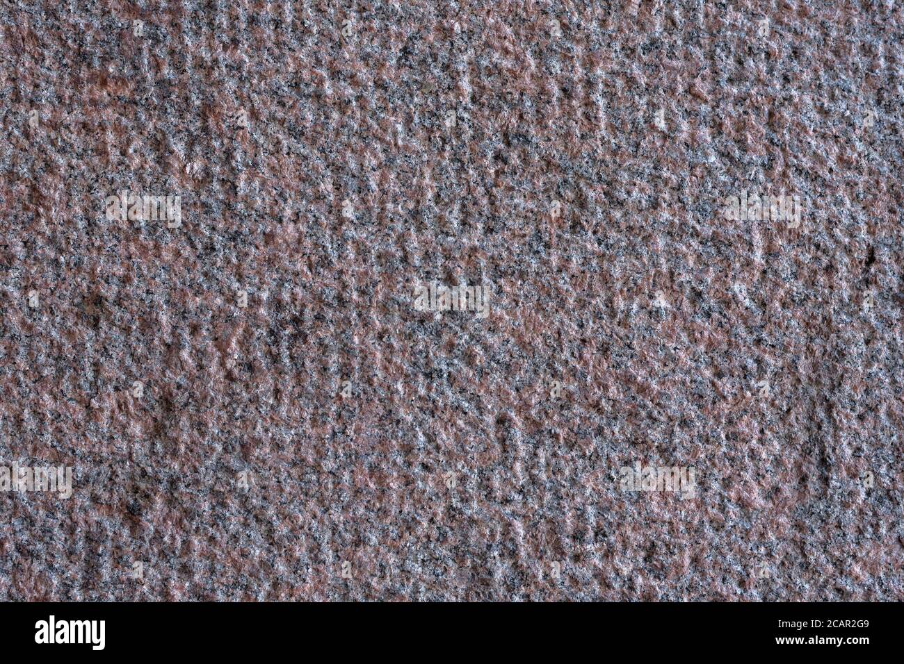 Roughly processed granite slab. Top view. Backgrounds and textures. Stock Photo