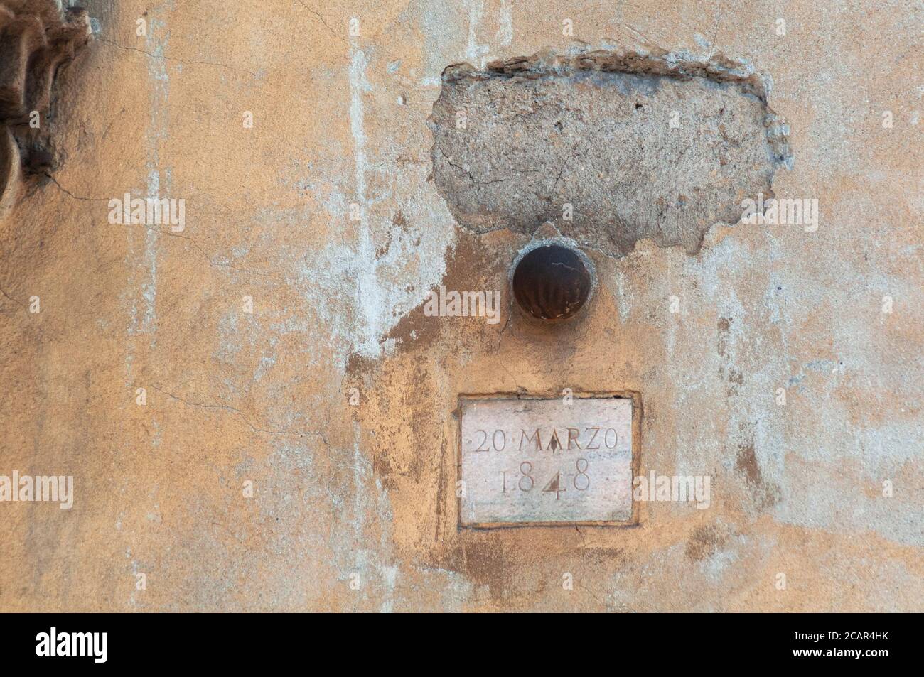 Italy, Lombardy, Milan, Corso di Porta Romana Street, Five Days of Milan, Cannon Ball Embedded in the Wall Stock Photo