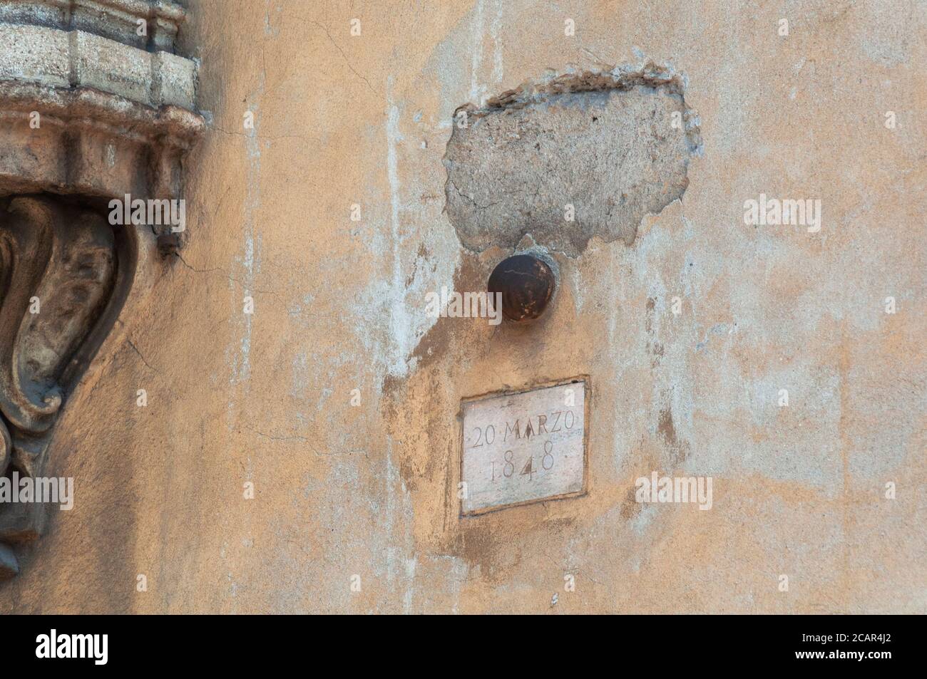 Italy, Lombardy, Milan, Corso di Porta Romana Street, Five Days of Milan, Cannon Ball Embedded in the Wall Stock Photo