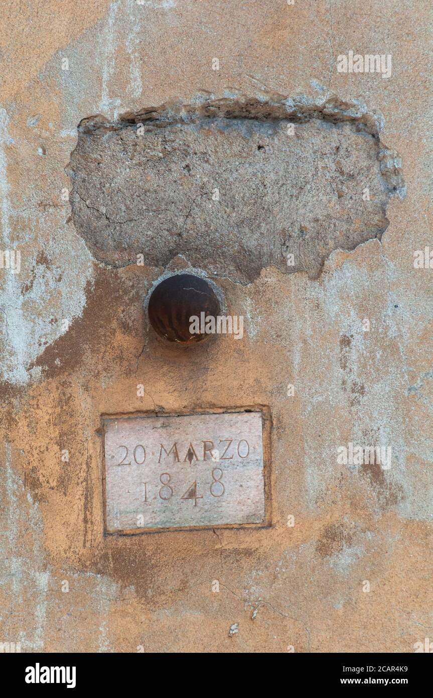Italy, Lombardy, Milan, Corso di Porta Romana Street, Five Days of Milan, Cannon Ball Embedded in the Wall Stock Photo