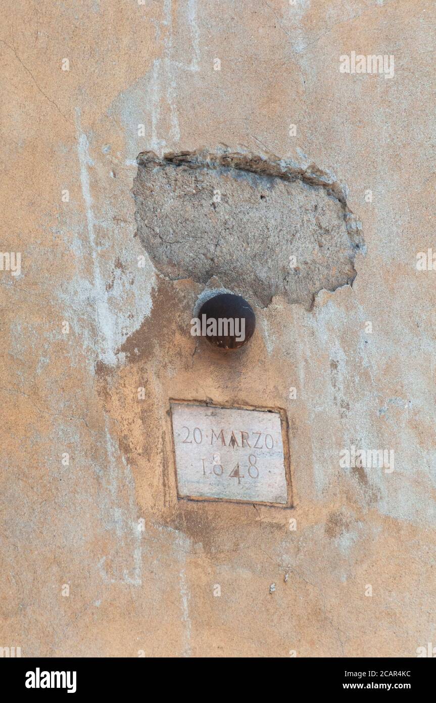 Italy, Lombardy, Milan, Corso di Porta Romana Street, Five Days of Milan, Cannon Ball Embedded in the Wall Stock Photo
