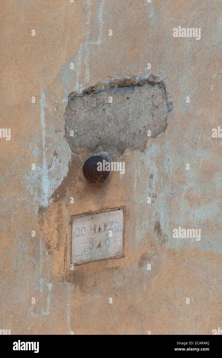 Italy, Lombardy, Milan, Corso di Porta Romana Street, Five Days of Milan, Cannon Ball Embedded in the Wall Stock Photo