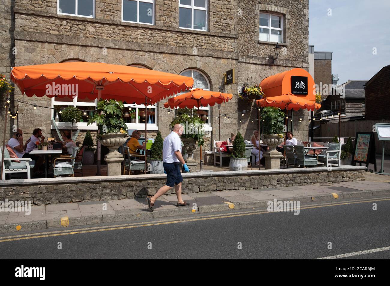People dine Alfresco outside Bills in Sevenoaks town centre, Kent Stock Photo
