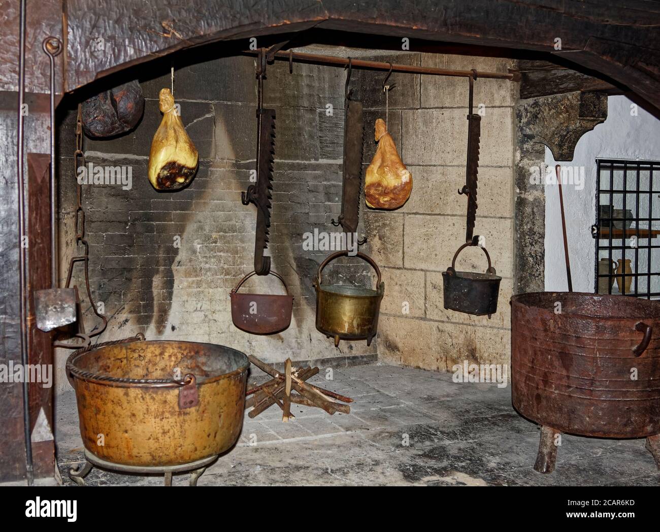 kitchen; large fireplace, old cooking pots hanging, meat, Marksburg Castle; 1231; Rhine River Valley; UNESCO World Heritage Site; Europe, Boppard; Ger Stock Photo