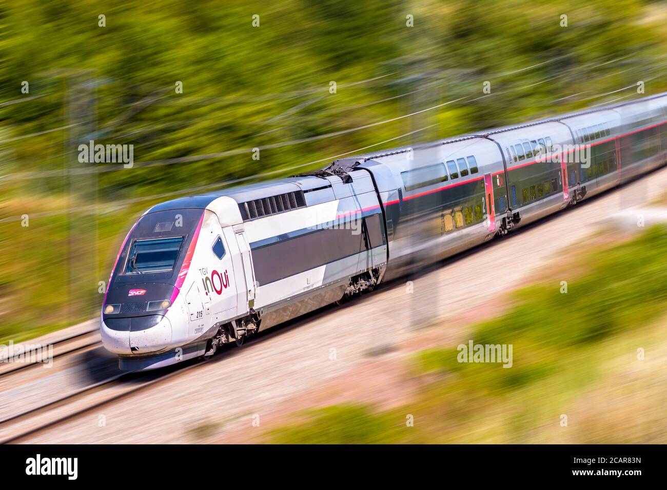 A TGV Duplex high speed train from french rail company SNCF is driving from  Paris on the LGV Sud-Est in the countryside Stock Photo - Alamy