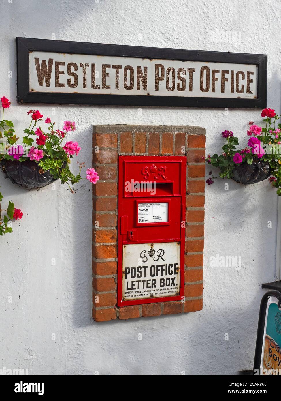Westleton village postbox  Suffolk in summer Stock Photo
