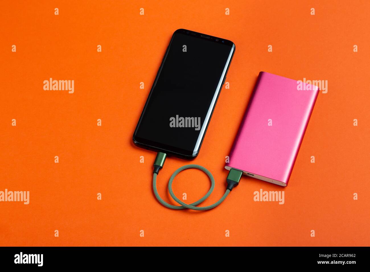 Smartphone charging with power bank. Portable power bank for charging