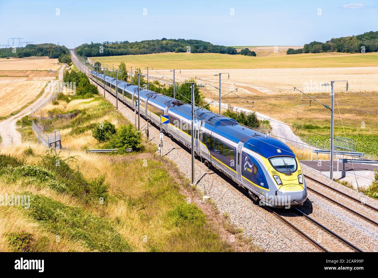 A Eurostar e320 high speed train is driving from Paris to London on the LGV Nord, the North European high speed rail track, in the french countryside. Stock Photo