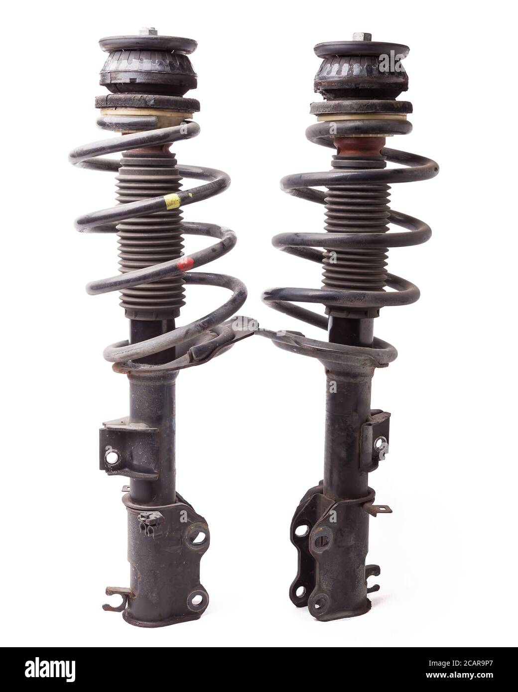 Two shock absorber struts with black springs after being used on a car