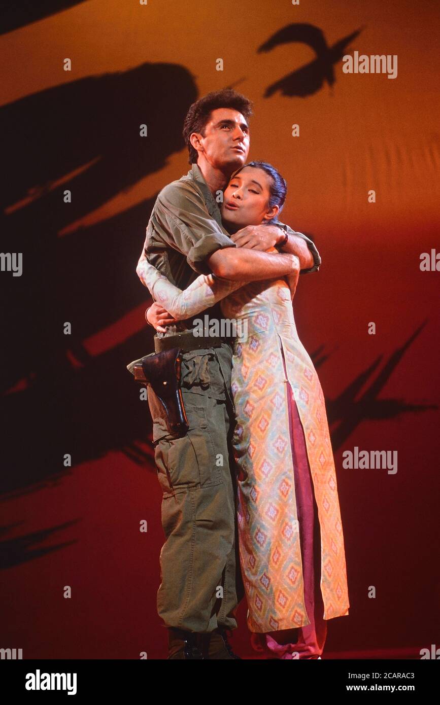The characters Chris Scott and Kim embrace during a photo call performance of Miss Saigon stage production, Theatre Royal, Drury Lane, London, UK. Circa 1989 Stock Photo