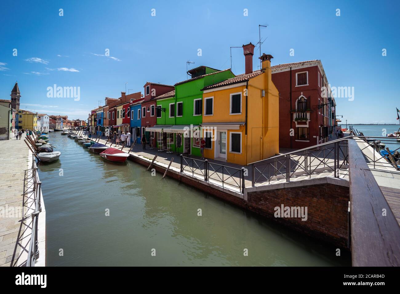 Burano island, Venetian Lagoon, Venice, Italy, panorama with the typical coloured homes frontages overlooking a canal crossing in the town centre Stock Photo