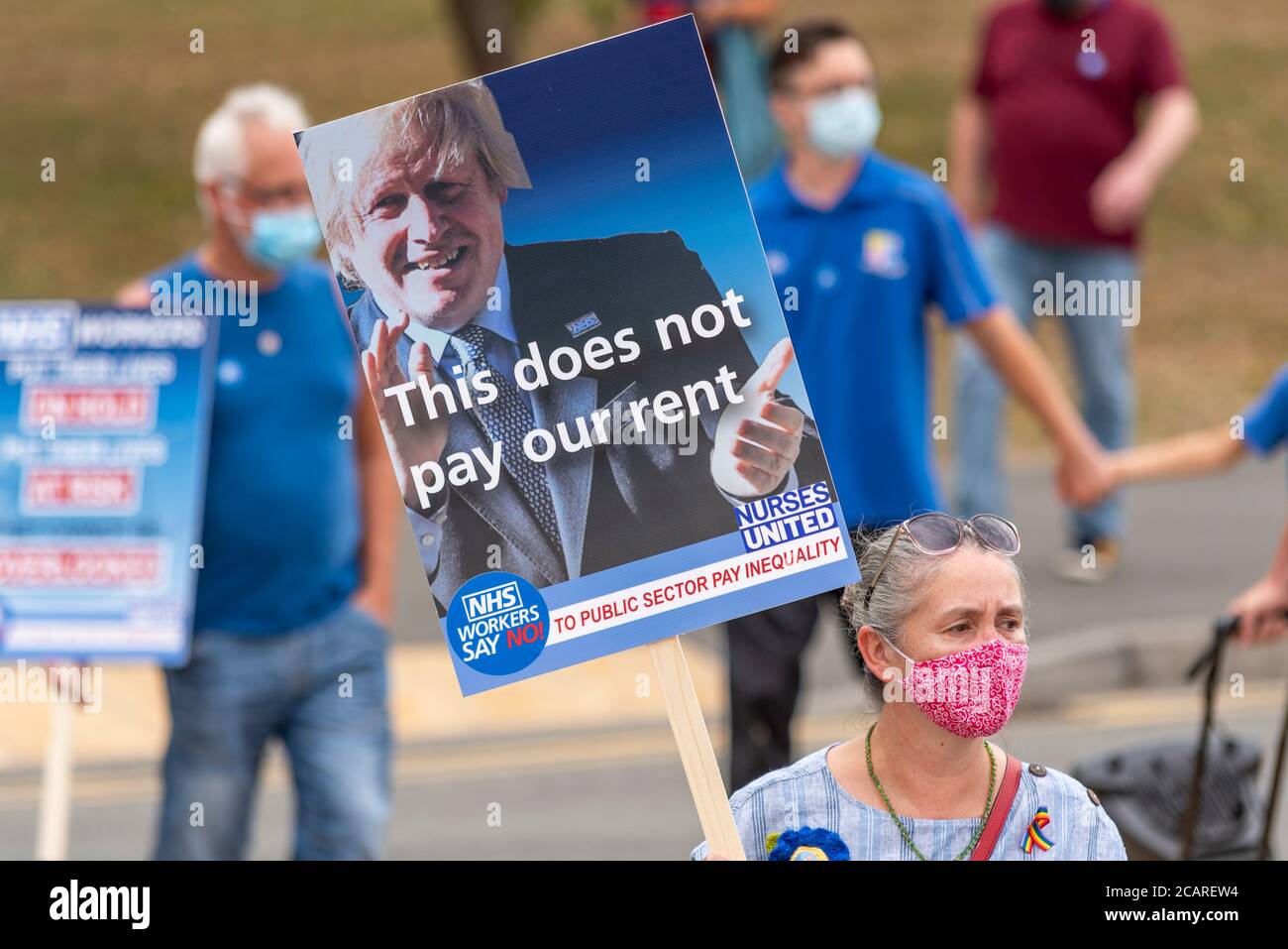 Boris Johnson placard at a NHS protest against missing out on public sector pay increase and honour the health staff killed by COVID-19, at Basildon Stock Photo