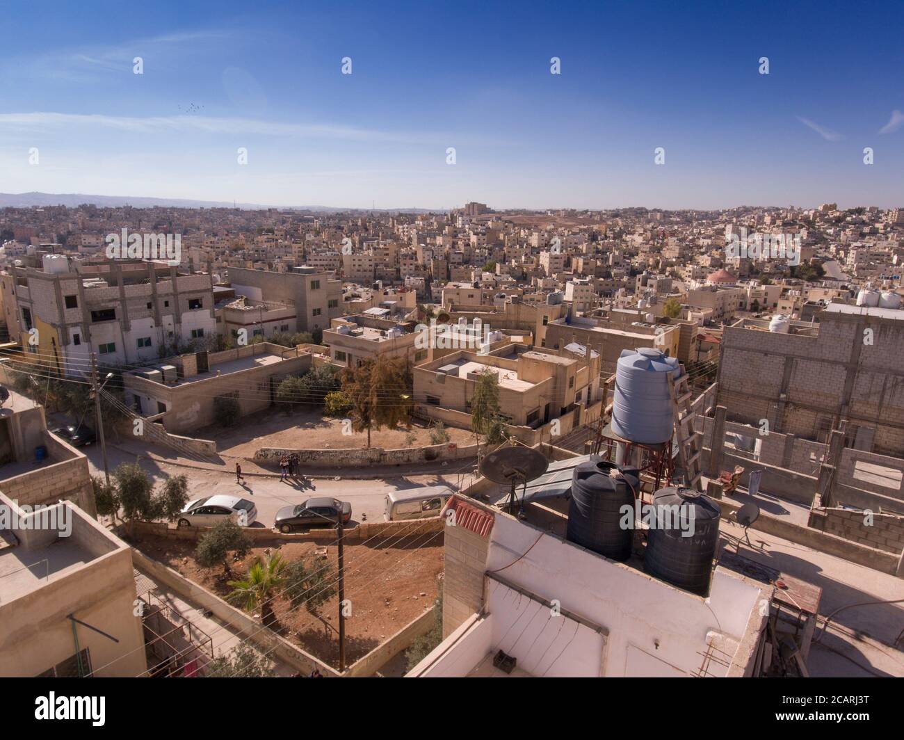 Rooftop water tanks are a common sight in the arid, sprawling city of