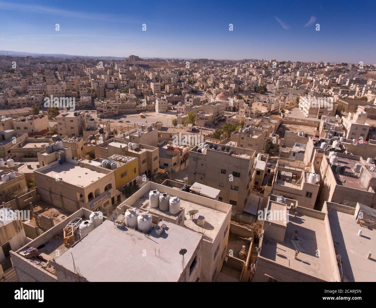 Rooftop water tanks are a common sight in the arid, sprawling city of