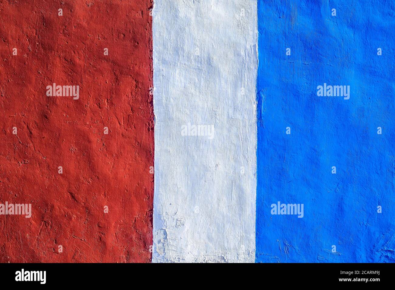 Vibrant color bands: saturated red and blue, painted surface, hard light. Stock Photo