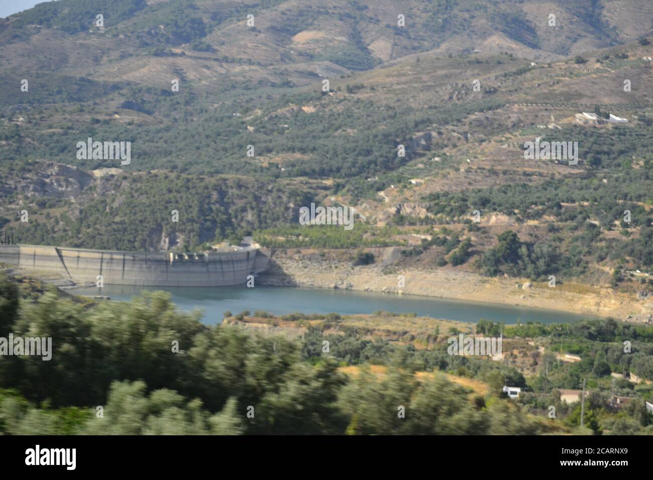 Trevlez is a village in the province of Granada. The river Trevlez flows through the village. They are located in the western part of the Alpujarras Stock Photo