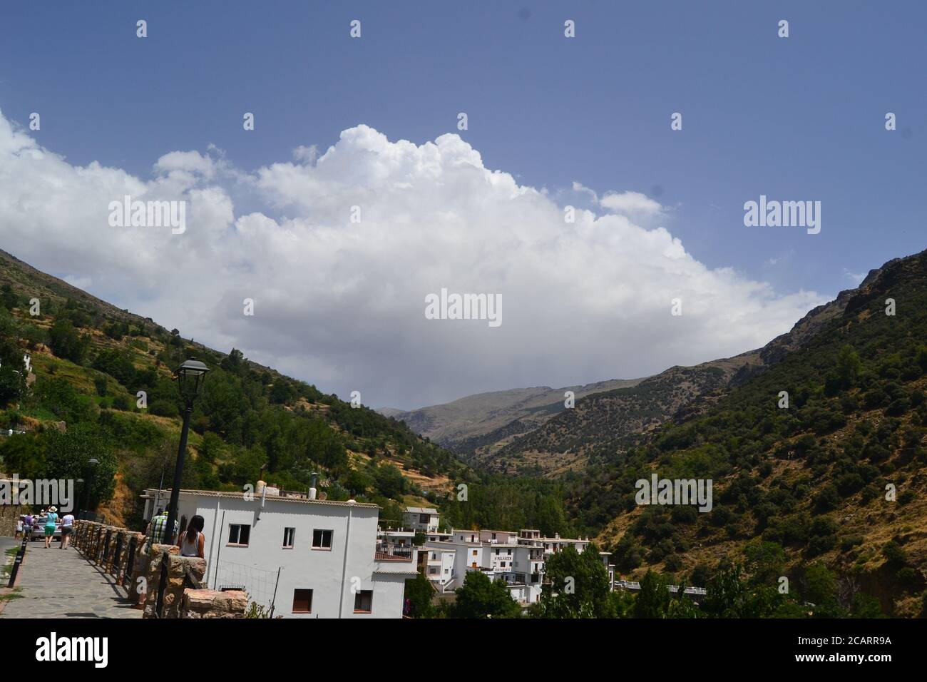 Trevlez is a village in the province of Granada. The river Trevlez flows through the village. They are located in the western part of the Alpujarras Stock Photo