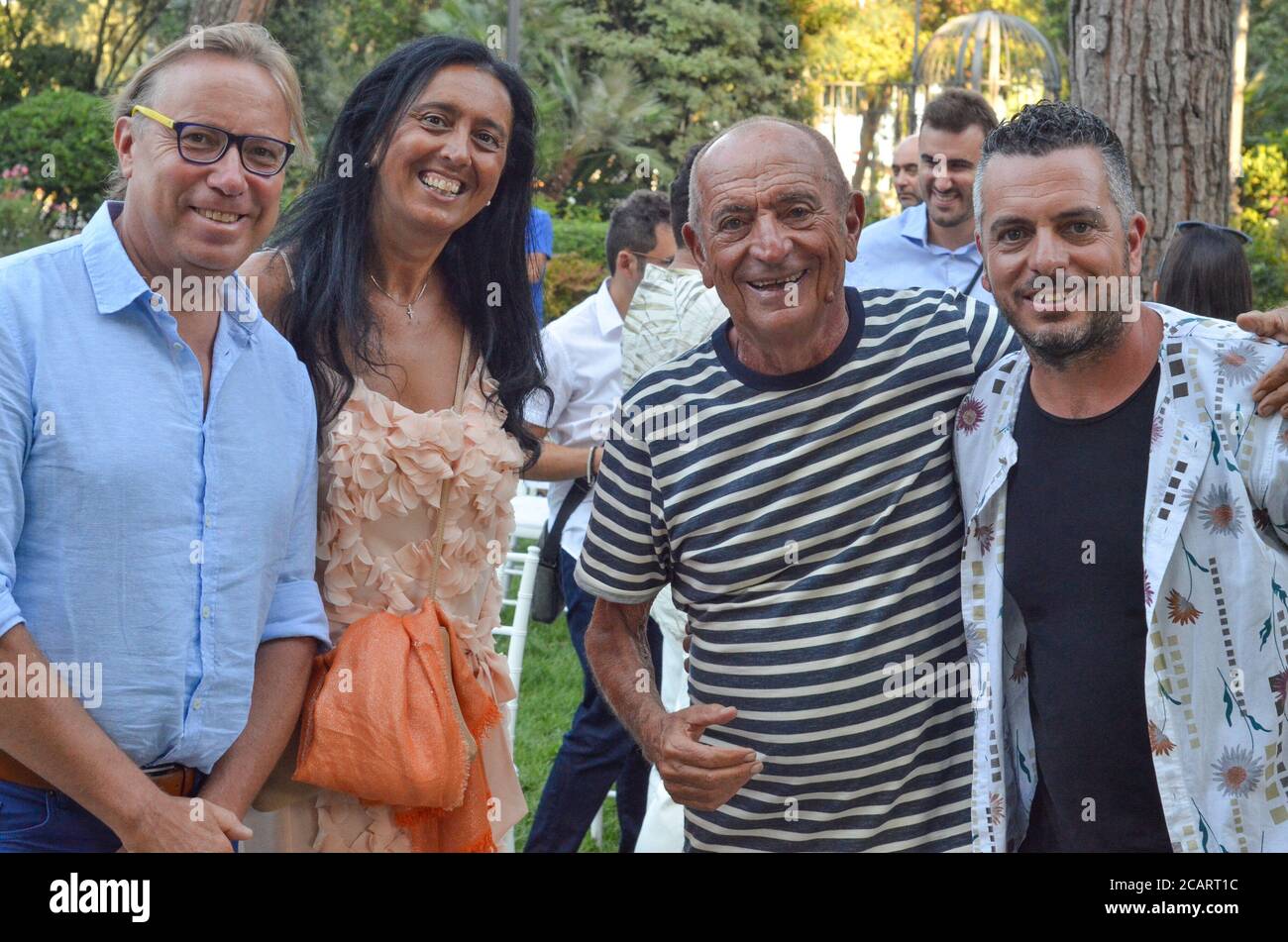 Rimini, ITA. 8th Aug, 2020. (INT) Meeting of two ICONS of Roman and Italian music. August 8, 2020, Rimini, Italy : In the splendid garden of the Grand hotel, a new meeting of La Terrazza della Dolce Vita took place where Giovanni Terzi interviewed Raoul and Mirko Casadei, two big names in Roman and Italian music.Credit: Josi Donelli/Thenews2 Credit: Josi Donelli/TheNEWS2/ZUMA Wire/Alamy Live News Stock Photo