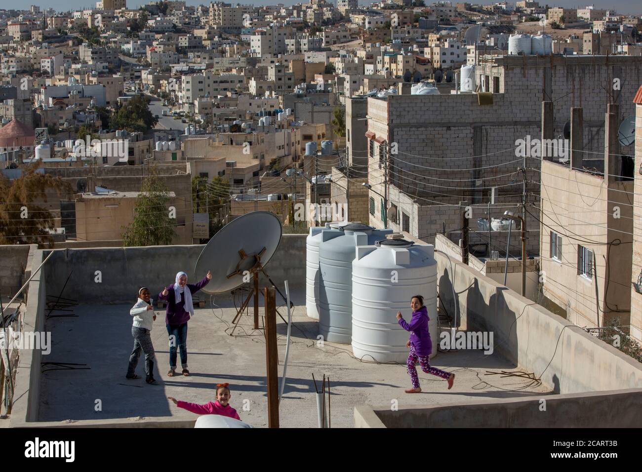 Rooftop water storage tanks are a common site in the arid city of Zarqa