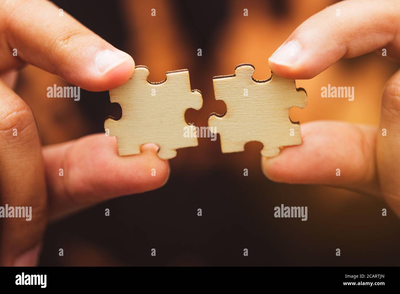 Man hand connecting jigsaw puzzle, Business solutions,Team work